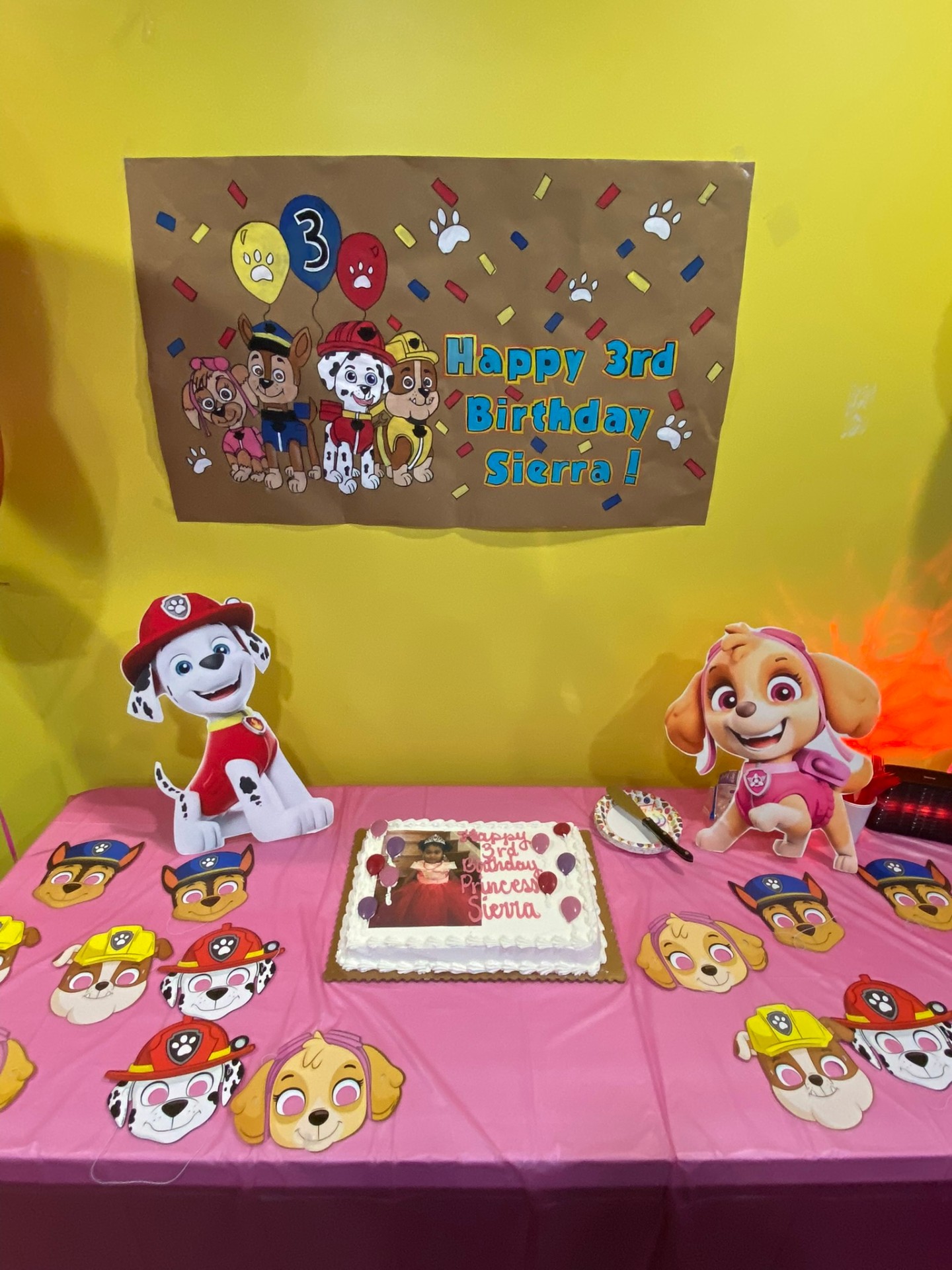Paw Patrol themed 3rd birthday setup for Sierra with cake and character cutouts