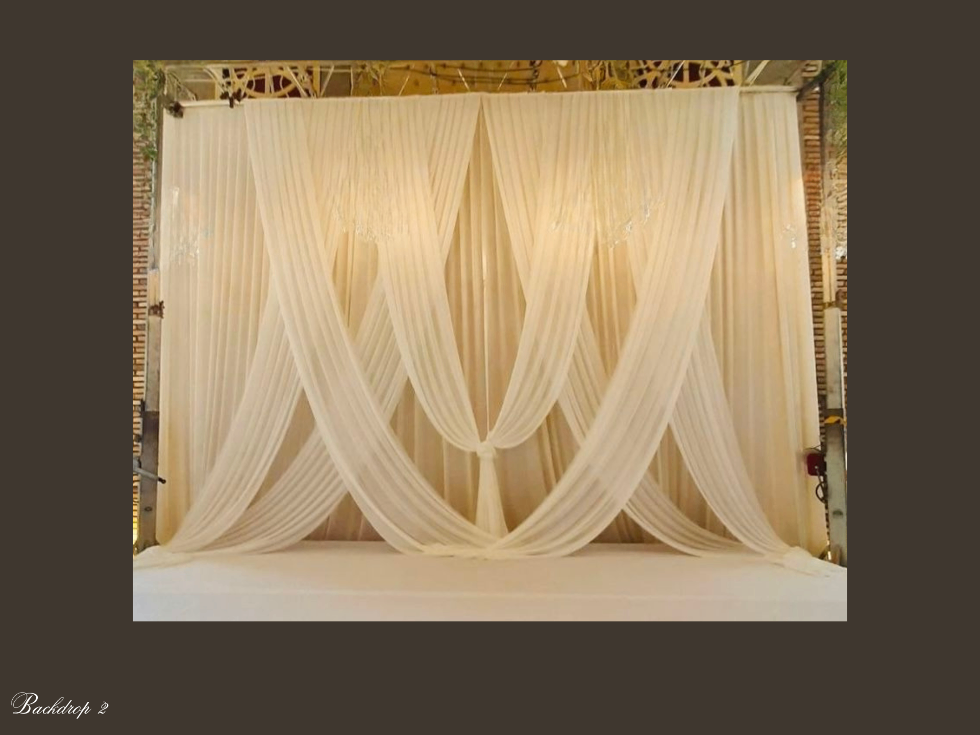 Ivory chiffon draped backdrop with elegant cascading fabric